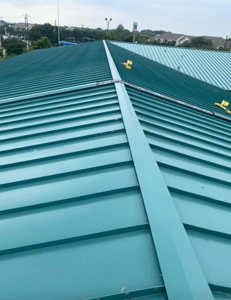 Green commercial metal roof ridge and valley for Metal Roof Repair in Topsham